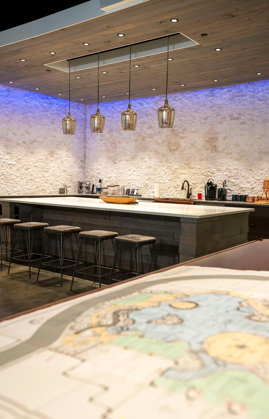 Modern kitchen with recessed ceiling lights and wood paneling